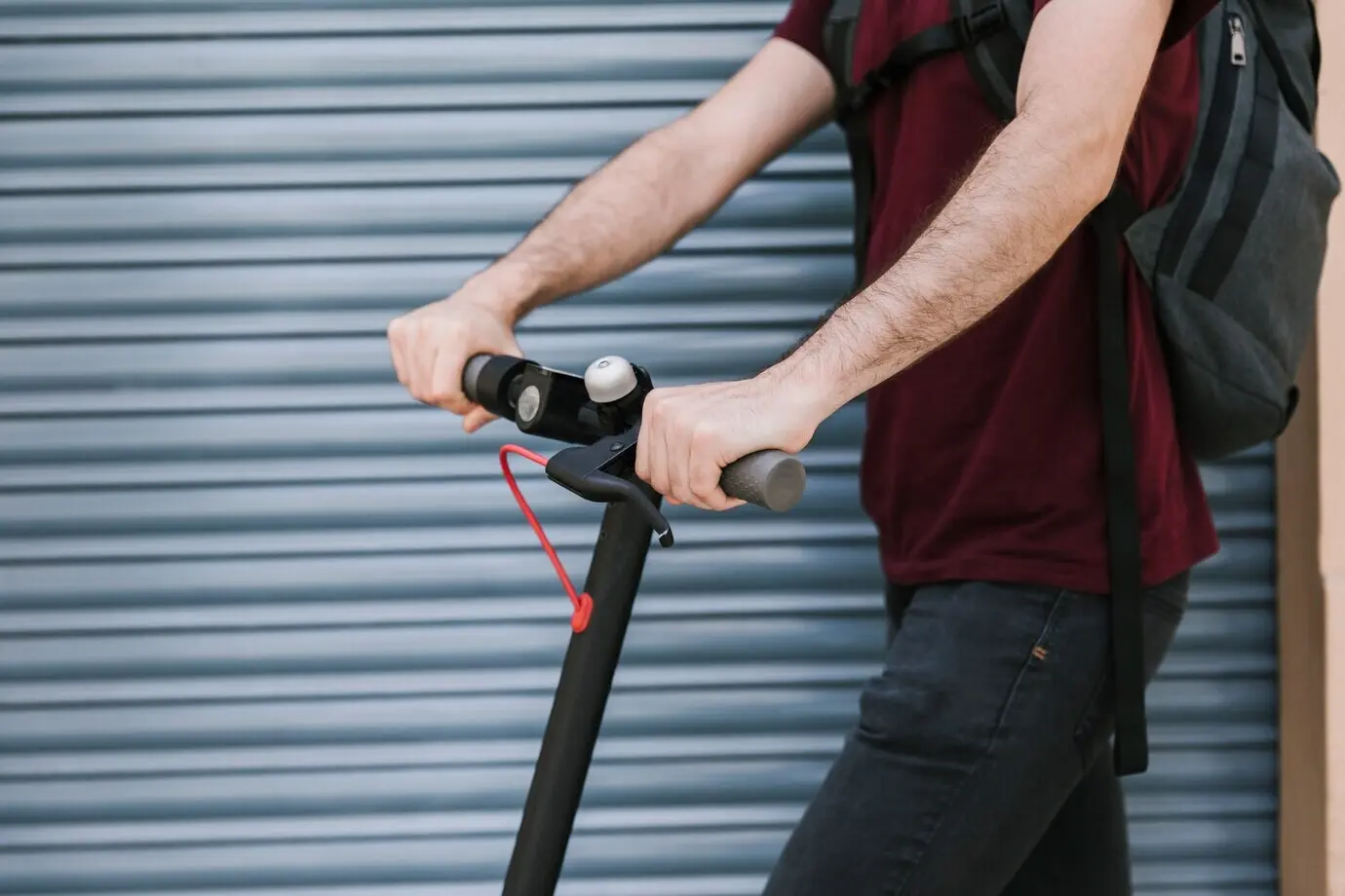 Side view of an e-scooter rider outdoors